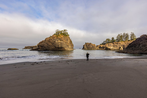 Woman on beach along Oregon Coast. Gold Beach, Oregon, United States