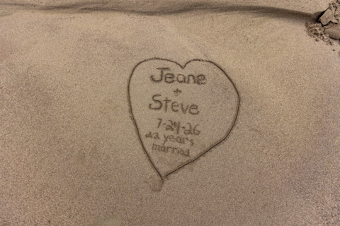Anniversary message in sand along Oregon Coast. Gold Beach, Oregon, United States