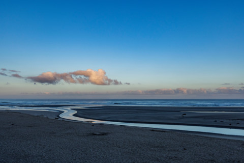 Ecola Creek flowing into Pacific Ocean. Cannon Beach, Oregon, United States