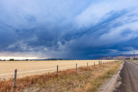 Storm clouds over fields and rural road. Bellevue, Idaho, United States
