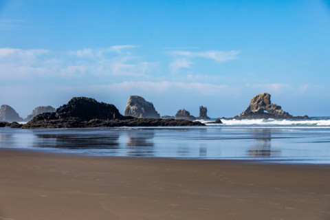 Calm ocean and rock formations on Oregon Coast. Cannon Beach, Oregon, United States