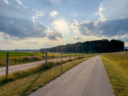 Sun shining over empty country road. Blacksburg, Virginia, United States
