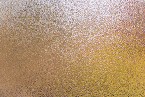 Condensation patterns on glass with warm tones. Leura, New South Wales, Australia