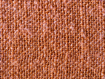 Textured detail of terracotta cotton fabric. Leura, New South Wales, Australia