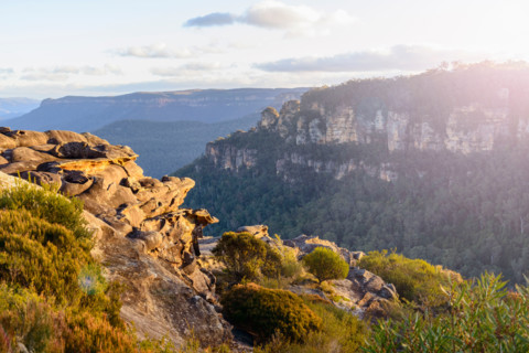 Golden sunset view of Three Sisters and Jamison Valley. Leura, New South Wales, Australia