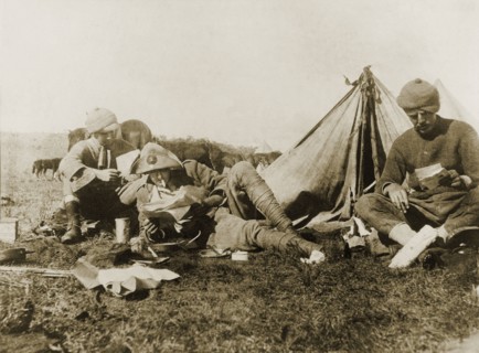 Reading letters from home. An Imperial Yeomanry serviceman, William Ernest Tweedie (right), sits