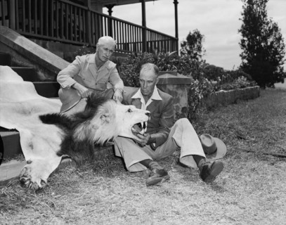 Clifford and Harold with lion skin. Clifford and Harold Hill seated with a lion skin on the steps