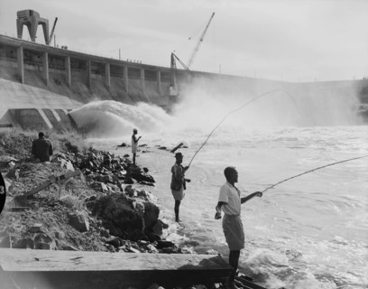 Fishing at the Owen Falls Dam. Men fishing at the site of the brand new Owen Falls Dam (Nalubaale