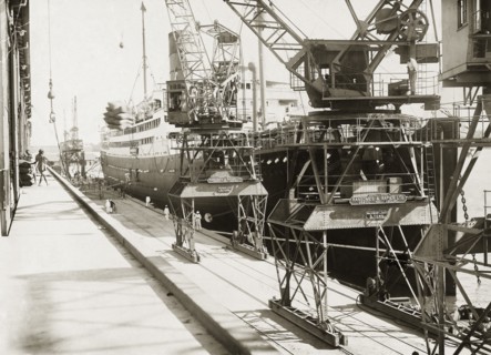 Dockside view at Kilindini harbour. SS Franconia and cranes on the dockside at Kilindini harbour.