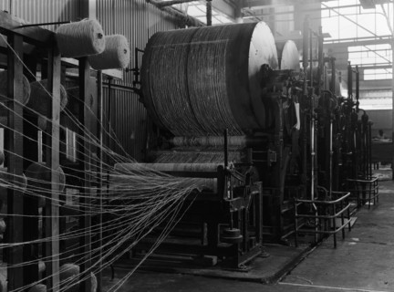 Starching threads. Machines starch threads at a factory producing goods for Sisal Products Ltd.