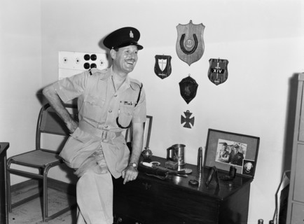 Jasper Maskelyne and his trophies. Jasper Maskelyne as a Kenyan Police officer proudly poses next