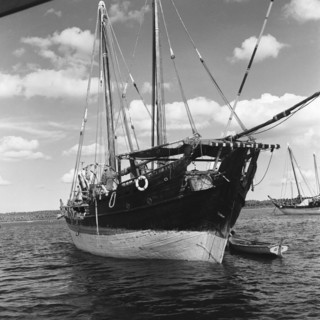 Dhow in a harbour. A dhow in a harbour off the coast of Zanzibar (now Tanzania) in the Indian ocean