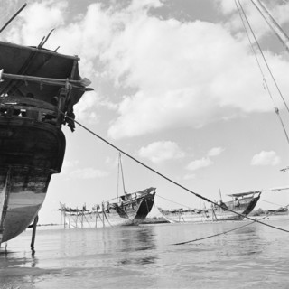 Dhows in a harbour. Dhows in a harbour off the coast of Zanzibar (now Tanzania) in the Indian ocean