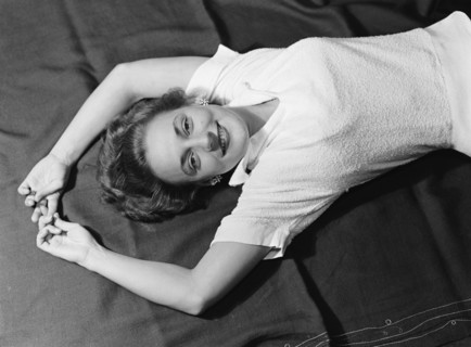 Cecily reclining. Cecily Gaueghan posing for a studio-style portrait. Kenya, 28 April 1953. Kenya,
