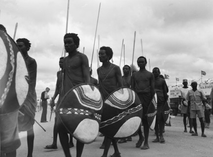 Maasai warriors. Maasai warriors holding spears and shields parade in traditional dress as they