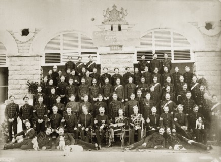 G.H. Gough's Troop. Portrait of a British regiment of the Indian Army in uniform. A sign within the