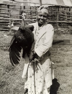 A member of the Young Farmers Club. A female member of the Young Farmers Club smiles for the