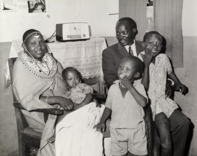 A 'modern' Maasai family. Portrait of a 'modern' Maasai family inside a home decorated with