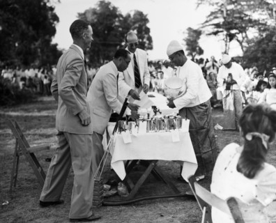 U Zin nearly dropping the Cup'. The President of the Rangoon Golf Club awards the Kyaw Min Cup (an