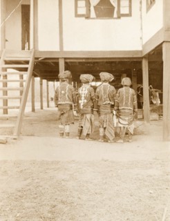 Four Kachin Women in traditional dress. Back view of four Kachin women. Dressed in traditional