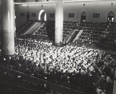 The congregation at the sixth Buddhist Synod. A Buddhist congregation packs out a large hall during