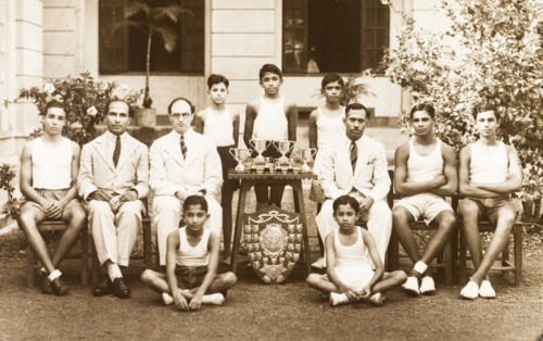 Sports team at the Royal College of Colombo. Outdoors portrait of a sports team with their trophies
