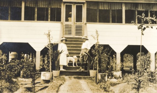 European couple on steps of colonial house. A European couple, identified as Mr and Mrs Johnson,