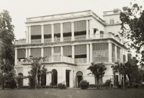 facade of a colonial-style building. The colonnaded facade of a two-storey, colonial building,