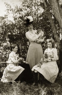 Playing with tiger cubs at Perth Zoo. Lady Annie Lawley (middle) and her daughters, Ursula (right)