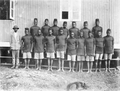 Employees of the Public Works Department. Group portrait of 17 African employees at the Public