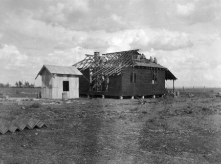 Building a house. This is the second in a series of four photographs showing the rapid erection of