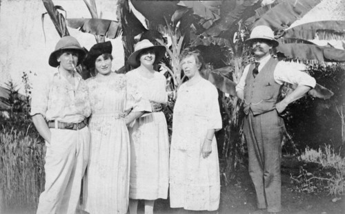 The Powis family. Informal group shot of a European family standing in front of a clump of banana
