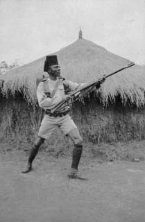 Askari from Second King's African Rifles. An African askari (soldier) poses with his gun in front