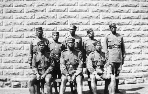 Warders at Nairobi Jail. Group portrait of eight African jail warders wearing uniform. Nairobi,