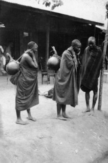 Milk sellers at Machakos. Two female milk sellers carry large gourds on their backs slung over