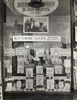 Empire goods from home and overseas. Signs in a shop window advertise a variety of Australian food