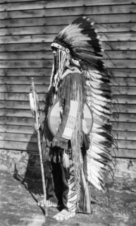 Native American costume. A European man dressed in traditional native American costume including a