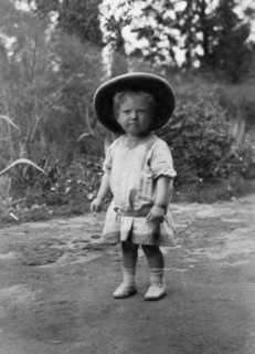 Child wearing a solatopi. Portrait of Allan Kidney as a toddler wearing a solatopi and belted dress