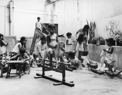 Sri Lankan nursery. Three women supervise a group of children at play in a well-equipped Methodist