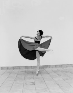 Daphne Dale as Carmen. Dancer Daphne Dale poses for the camera balancing on one toe. Playing the