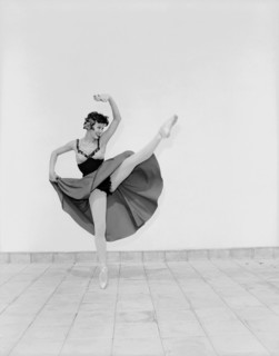 Daphne Dale as Carmen. Dancer Daphne Dale poses for the camera balancing on one toe. Playing the
