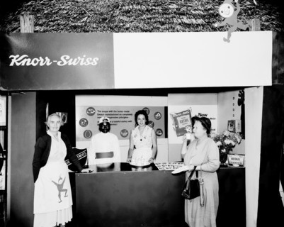 Knorr-Swiss stand at the Royal Show. A European woman samples a cup of soup from a Knorr-Swiss