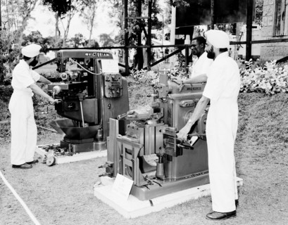 Milling machines at the Royal Show. Two turbaned Indian men demonstrate milling machines at the G &