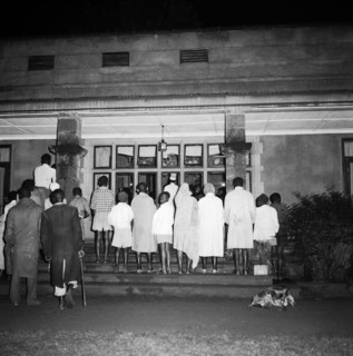 Exclusive entry at the SJAK dance. A group of African spectators watch a dance held for the Sports