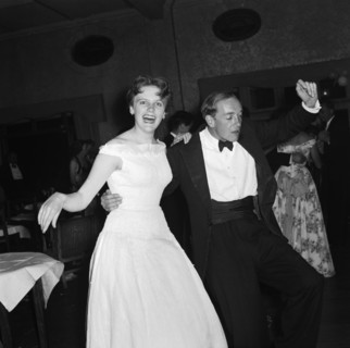 On the dancefloor at the SJAK dance. A formally dressed couple enjoy themselves on the dance floor