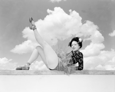 Sonja in Japanese costume. Sonja poses wearing theatrical costume comprising a tutu and ballet
