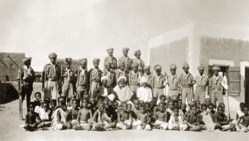 African scout group. Portrait of an African scout group in Sinkat. Uniformed scouts carrying sticks