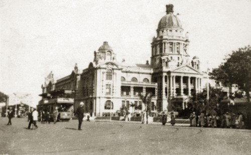 Durban town hall. Street scene outside the town hall in Durban city centre, showing a crowd of