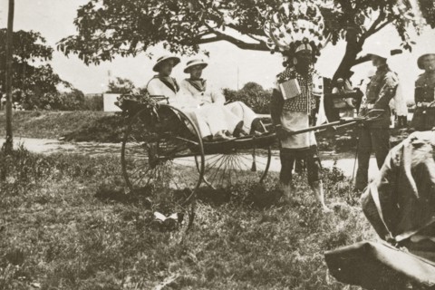 Rickshaw puller in Durban. A rickshaw puller wearing traditional costume and a flamboyantly