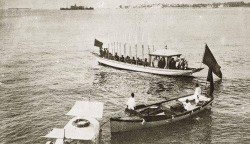 Sultans and Sheiks aboard a barge. A Sultan and Sheiks aboard an official state barge decorated